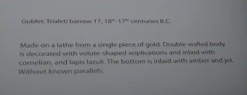 Gold goblet with lapis lazuli on twirls